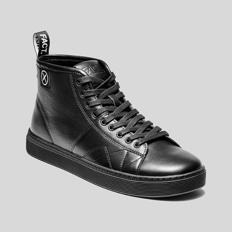 Angled view of the CNTRL high-top black leather shoe by FACT., featuring lace-up upper, heel pull tab, and skate-inspired cupsole.