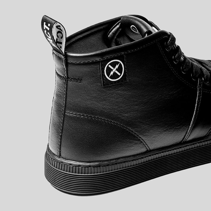 Close-up of the CNTRL shoe's heel showing FACT. logo patch, leather upper, heel pull tab, and control-pattern cupsole.