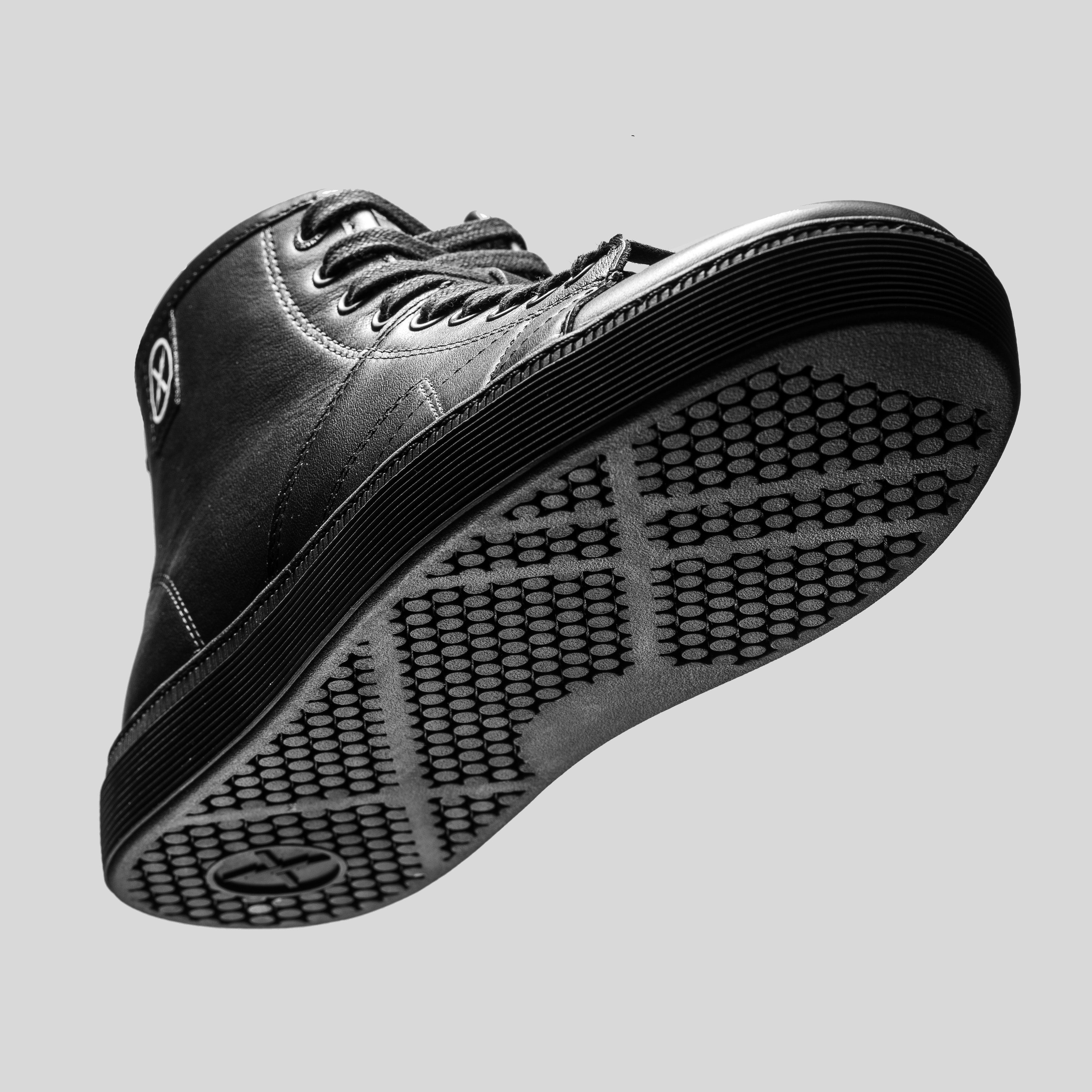 Underside view of the CNTRL high-top shoe by FACT., highlighting the textured control-pattern cupsole tread and leather upper.