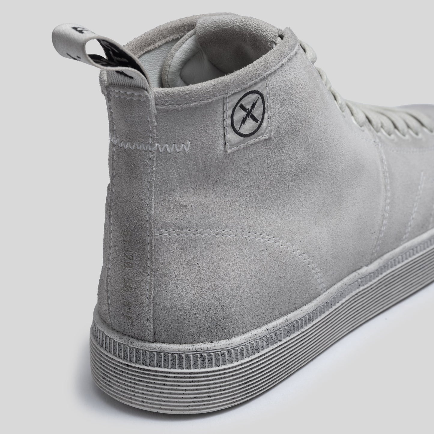 Close-up of the CNTRL boot heel in Dirty White Suede