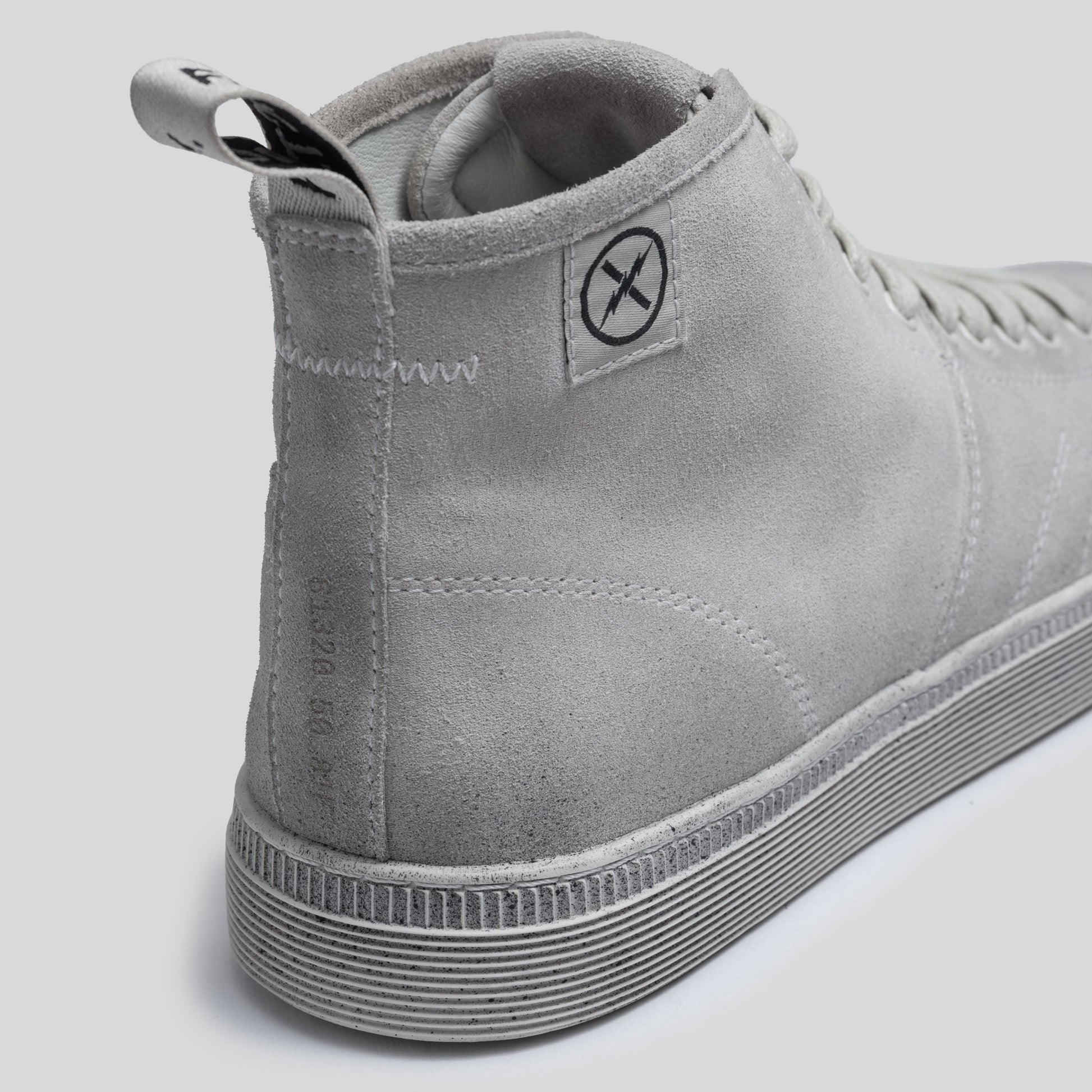Close-up of the CNTRL boot heel in Dirty White Suede